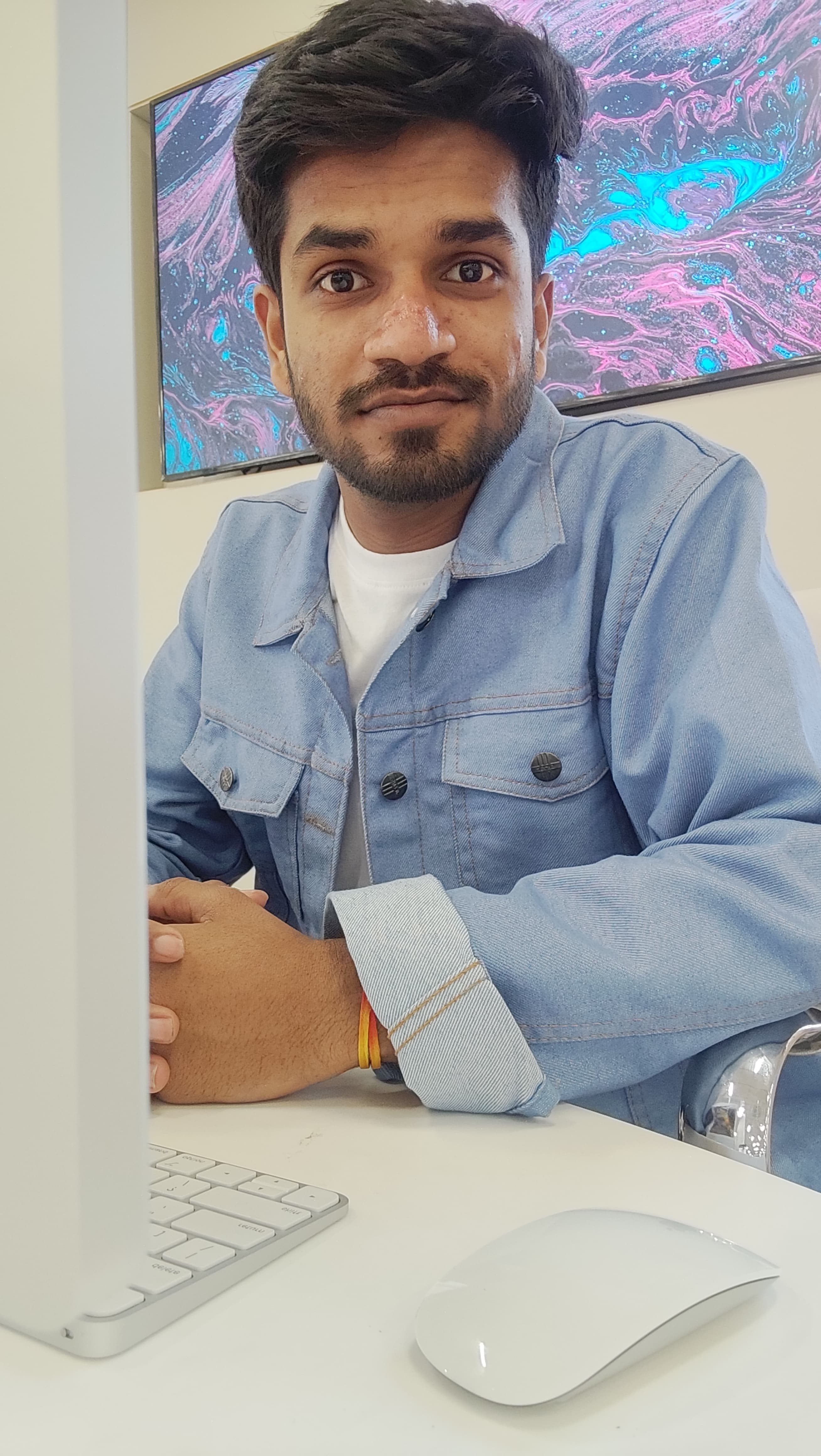 A member of Team Sakhi at an iMac during the build