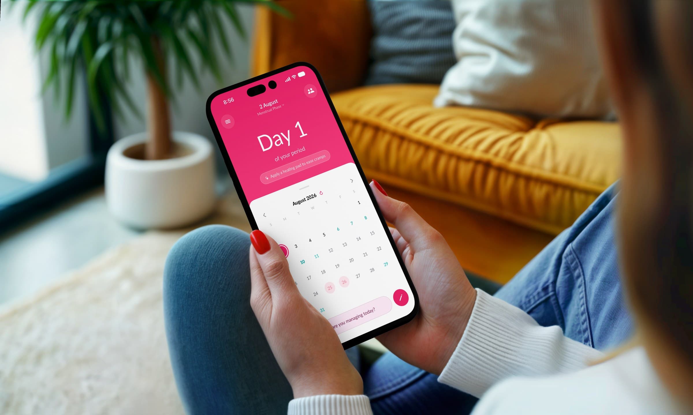 A woman at home holding the Sakhi app open on day 1 of her period